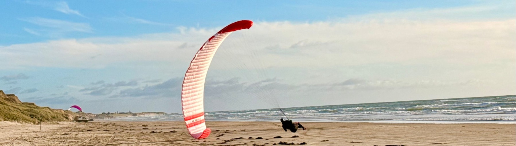 Parakite soaring on the beach